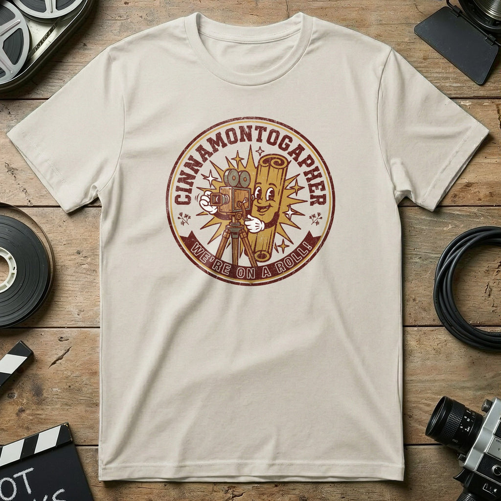 Cinnamon toast character with camera and film reel, text "Cinnamon tographer: We're on a roll!"