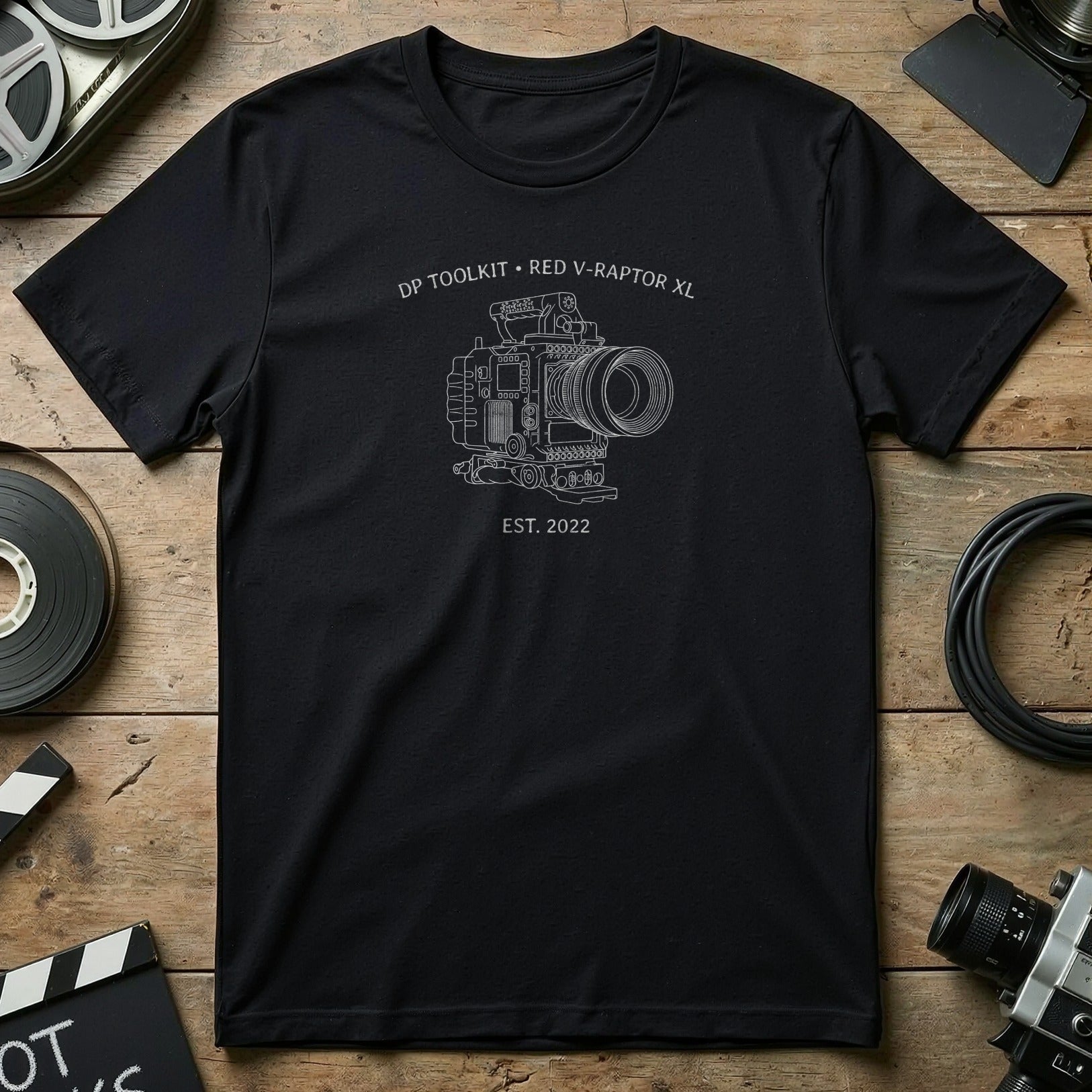 Black t-shirt with line drawing of RED V-RAPTOR XL camera and "DP TOOLKIT EST. 2022" text.