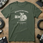 Green t-shirt with a vintage 16mm film camera graphic and text.