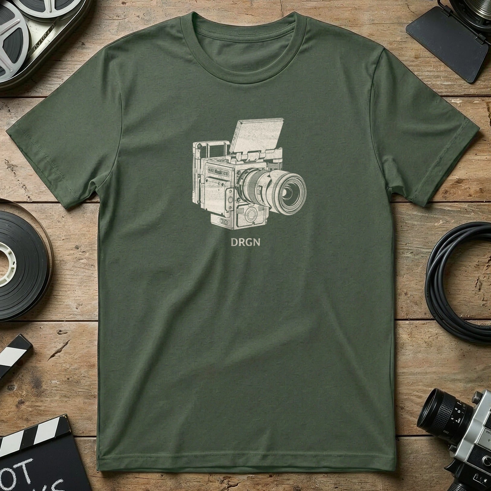 Green t-shirt with white line drawing of a vintage camera and "DRGN" text.