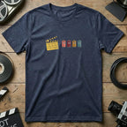 Dark blue t-shirt with cartoon film canisters and clapperboard graphic.