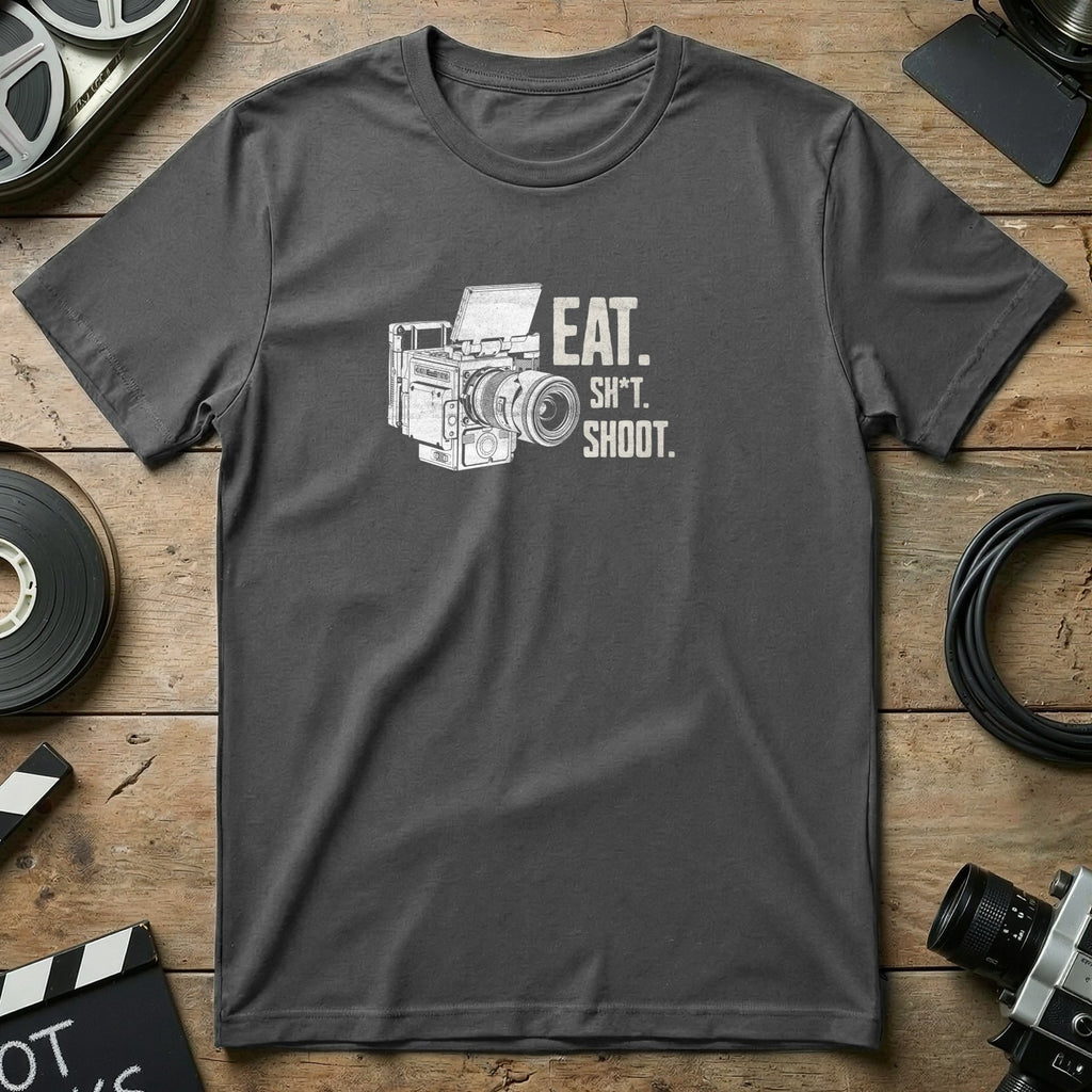 Dark t-shirt with "EAT. SH*T. SHOOT." and vintage camera graphic.