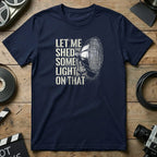 Navy t-shirt with text "Let me shed some light on that" and a spotlight graphic.