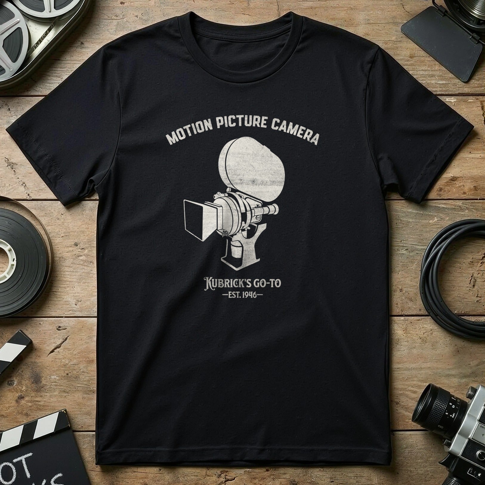 Black t-shirt with "Motion Picture Camera Kubrick's Go-To -Est. 1946" graphic.