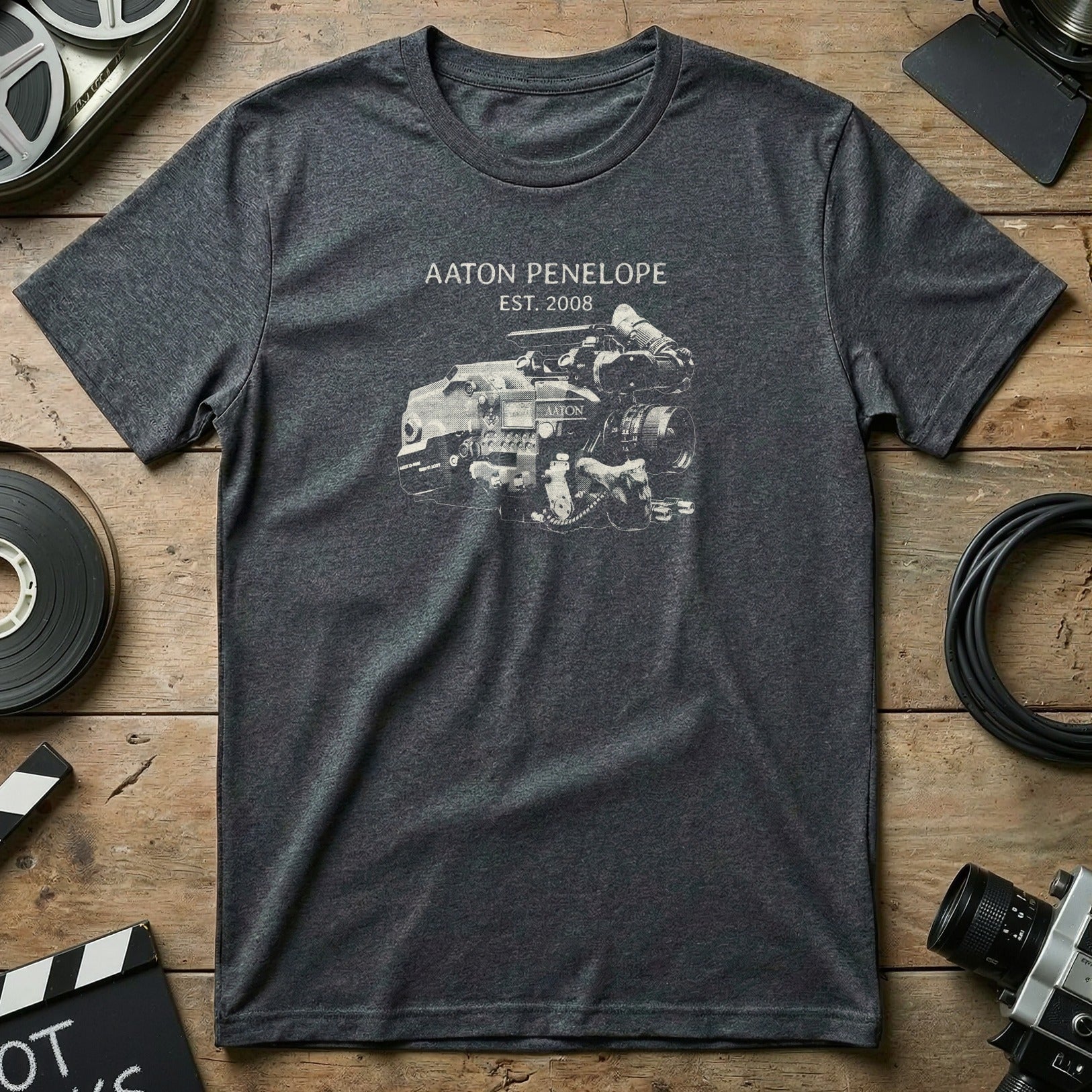 Dark grey t-shirt with "AATON PENELOPE EST. 2008" and camera engine graphic.