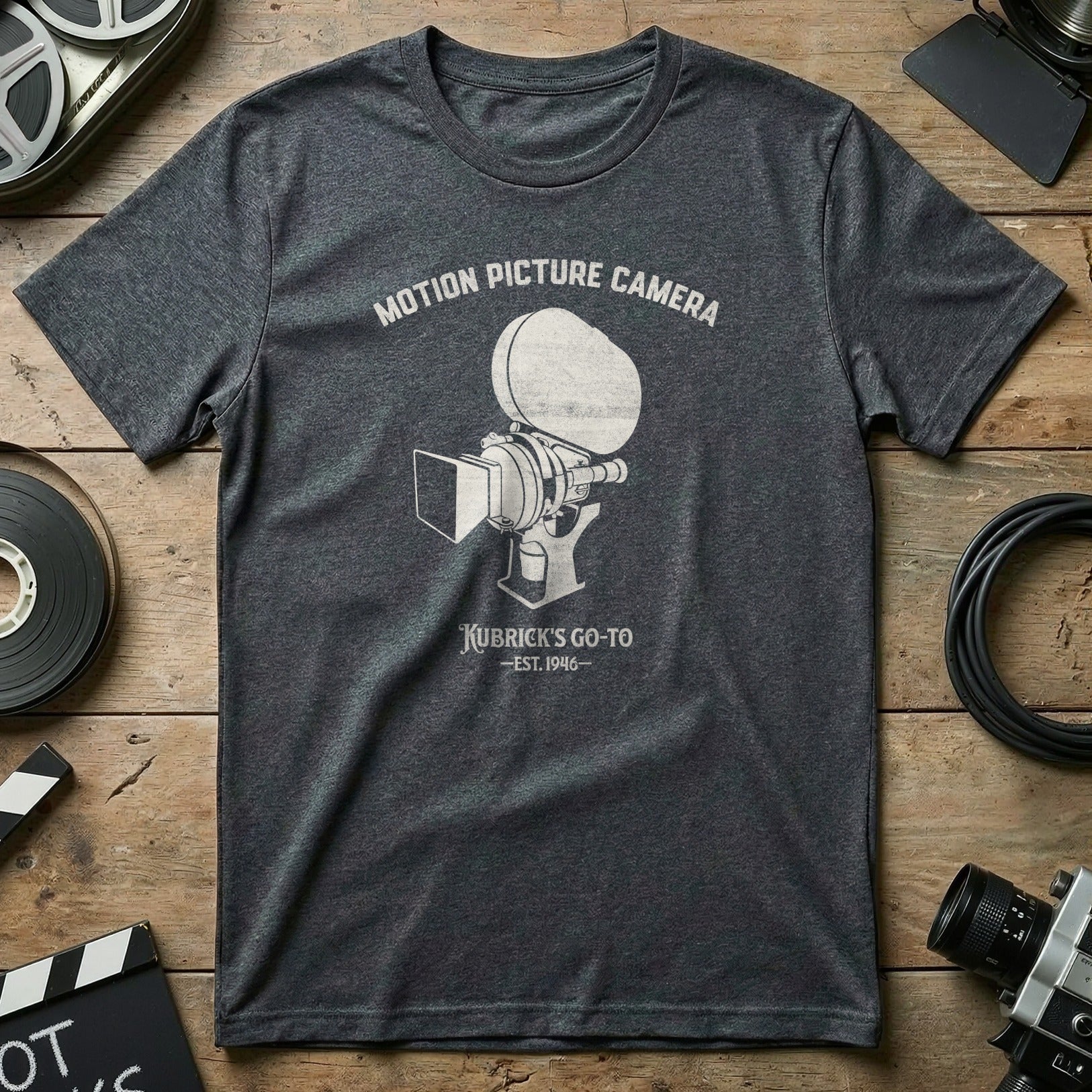 Dark grey t-shirt with "Motion Picture Camera Kubrick's Go-To EST. 1946" graphic.