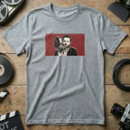 Gray t-shirt with graphic of Stanley Kubrick holding a film camera.