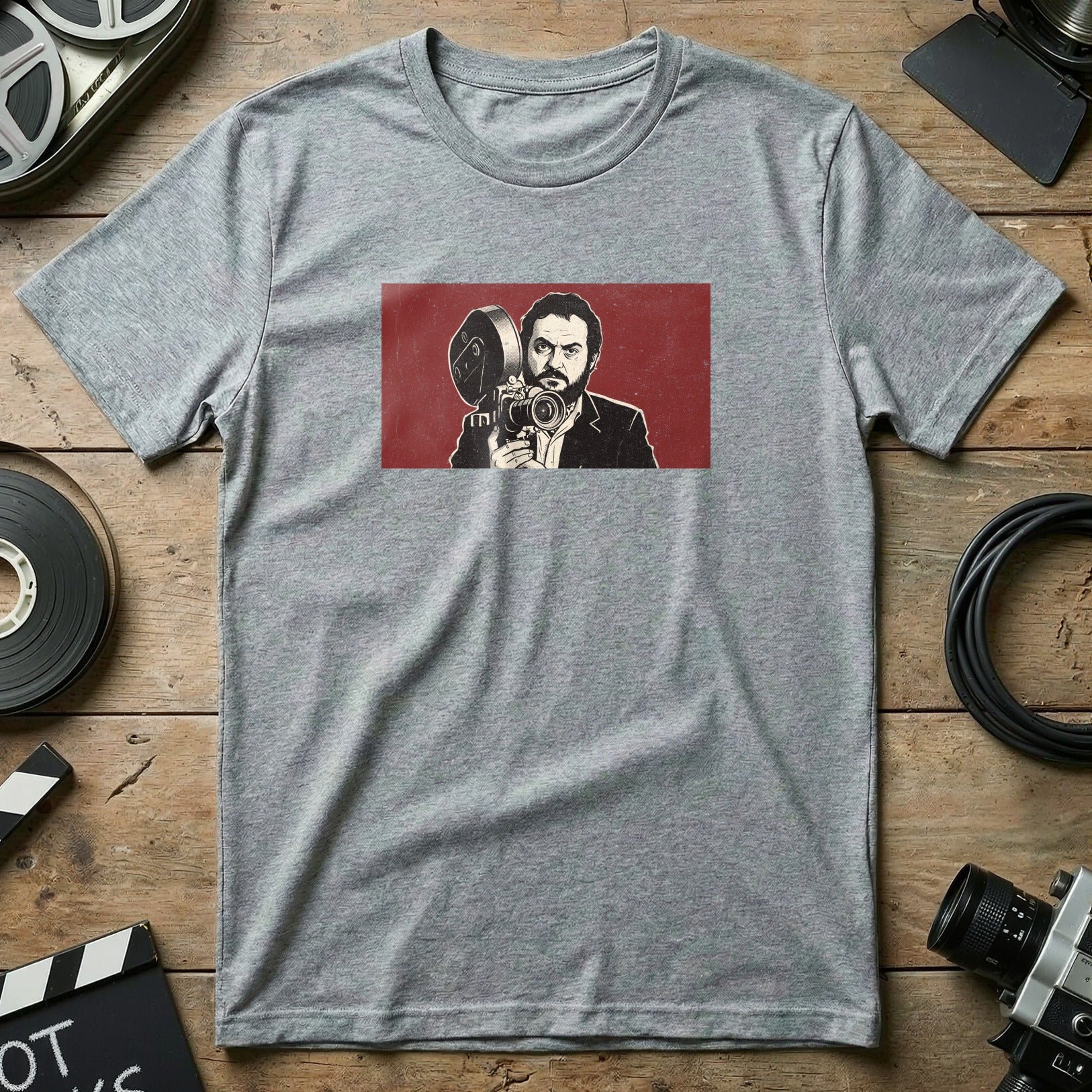Gray t-shirt with graphic of Stanley Kubrick holding a film camera.