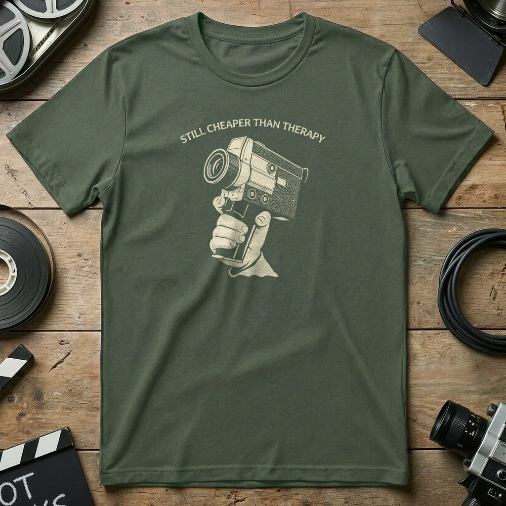Olive green t-shirt with graphic of a hand holding an old film camera.