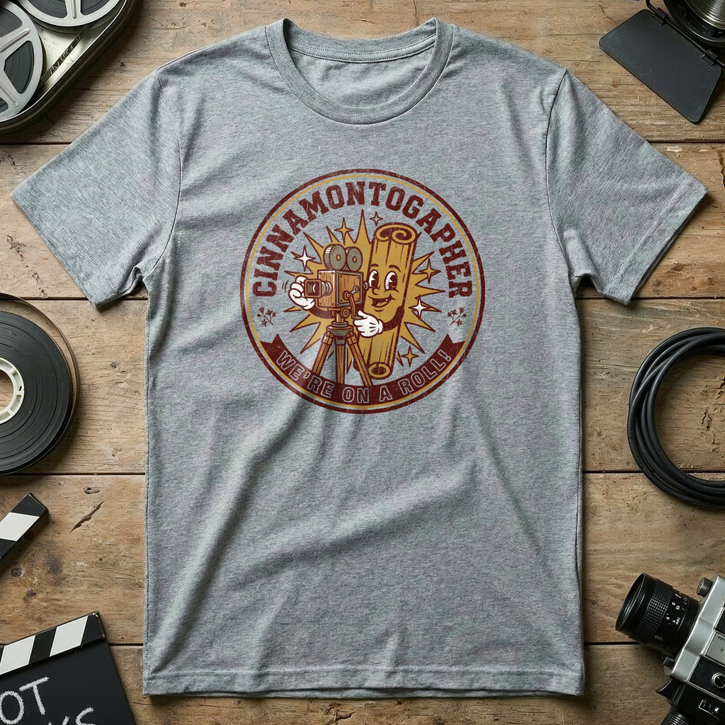 "Cinnamentographer" logo with text "We're on a roll!" on a gray t-shirt.