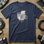 Navy t-shirt with a line drawing of a vintage film camera and the text DRGN.