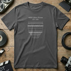 Dark grey t-shirt featuring a white line drawing of an ARRI Ultra Prime lens.