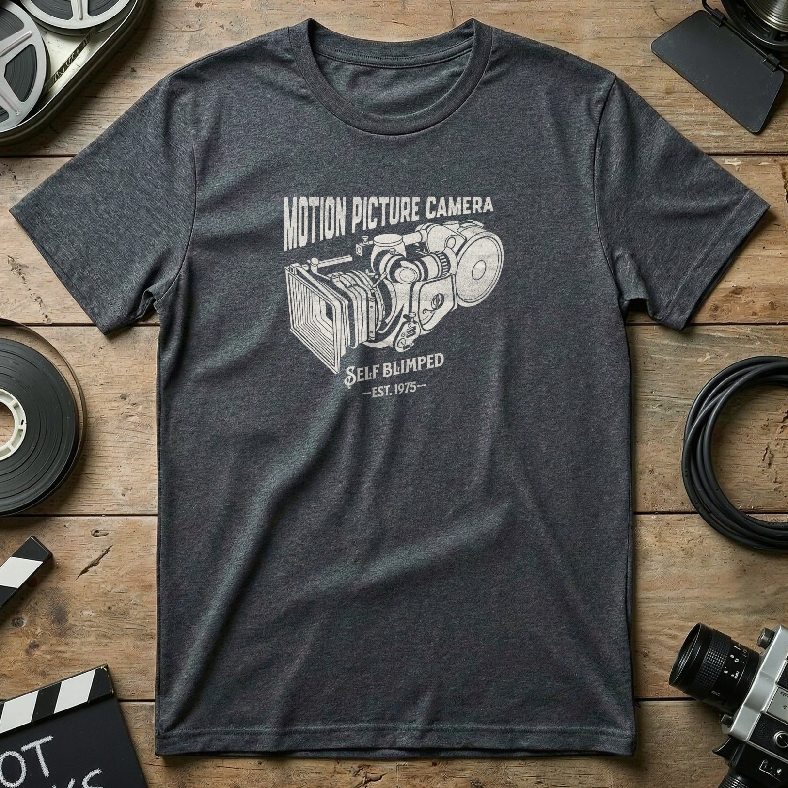 Charcoal t-shirt with vintage motion picture camera graphic and "Self Blimpd Est. 1975" text.