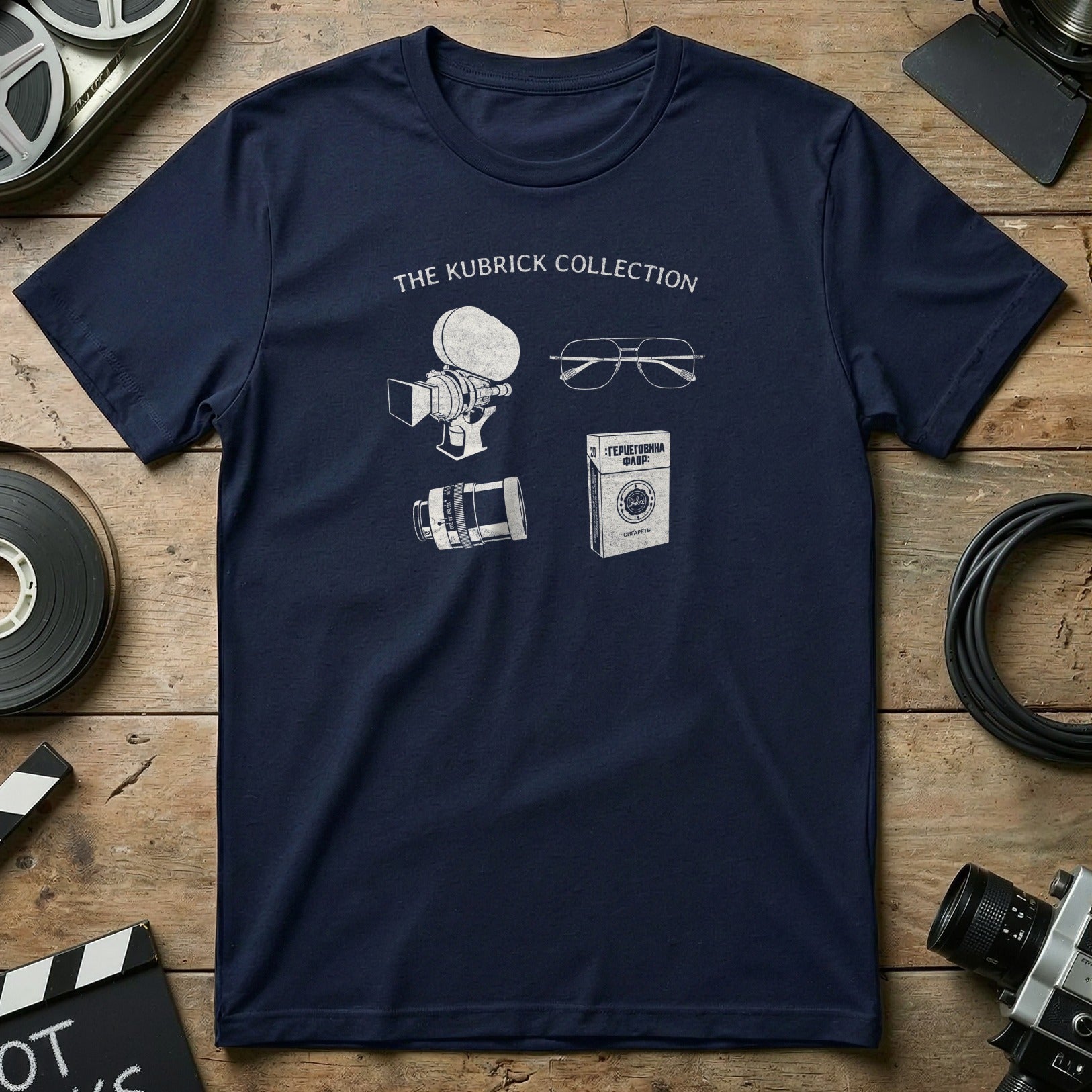 Navy t-shirt with "The Kubrick Collection" and line drawings of camera, glasses, and film.