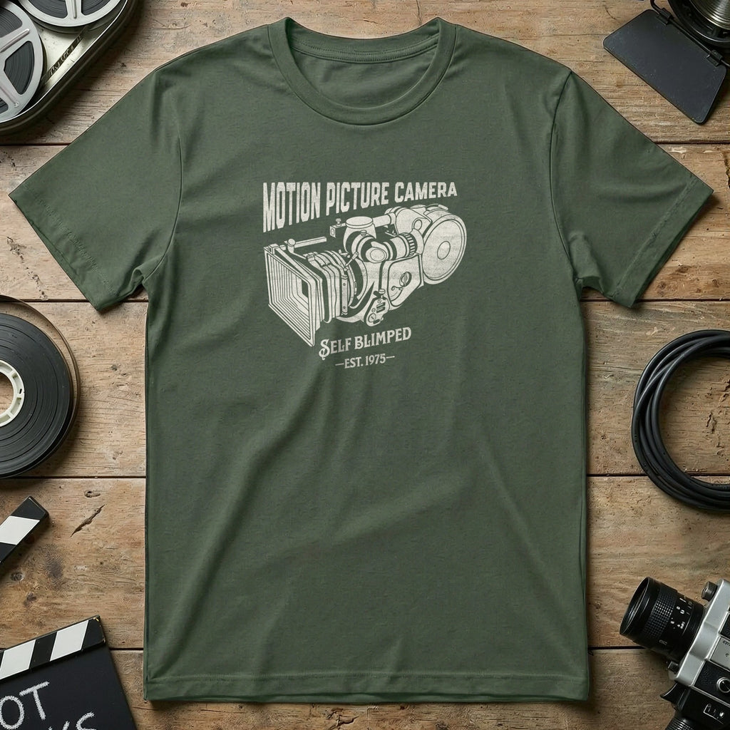 Olive green t-shirt with "Motion Picture Camera" and "Self Blimped - Est. 1975" text.