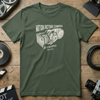 Olive green t-shirt with "Motion Picture Camera" and "Self Blimped - Est. 1975" text.