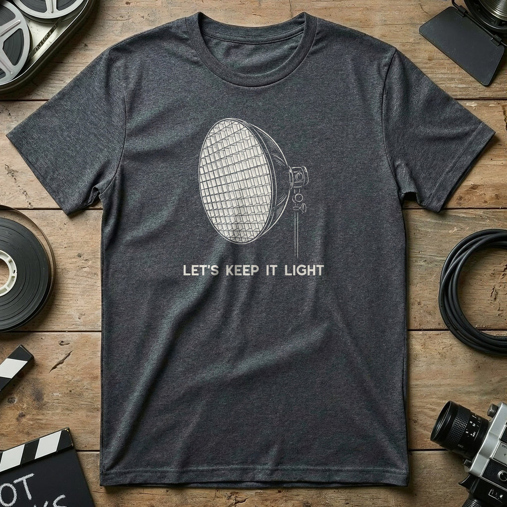 Dark grey t-shirt with graphic of a spotlight and text "LET'S KEEP IT LIGHT".