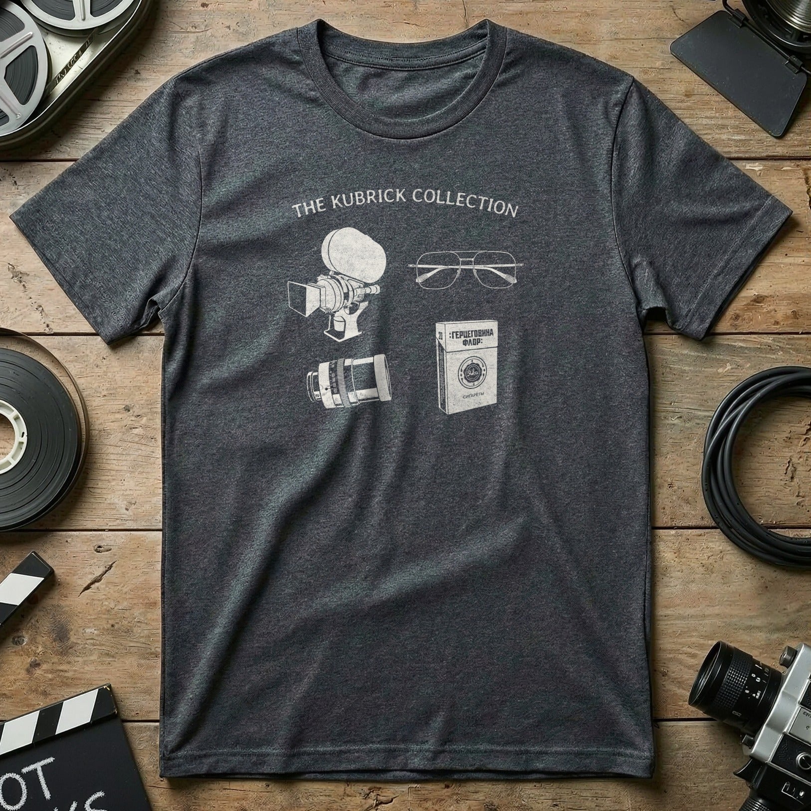 Dark grey t-shirt with "The Kubrick Collection" and illustrations of film equipment.
