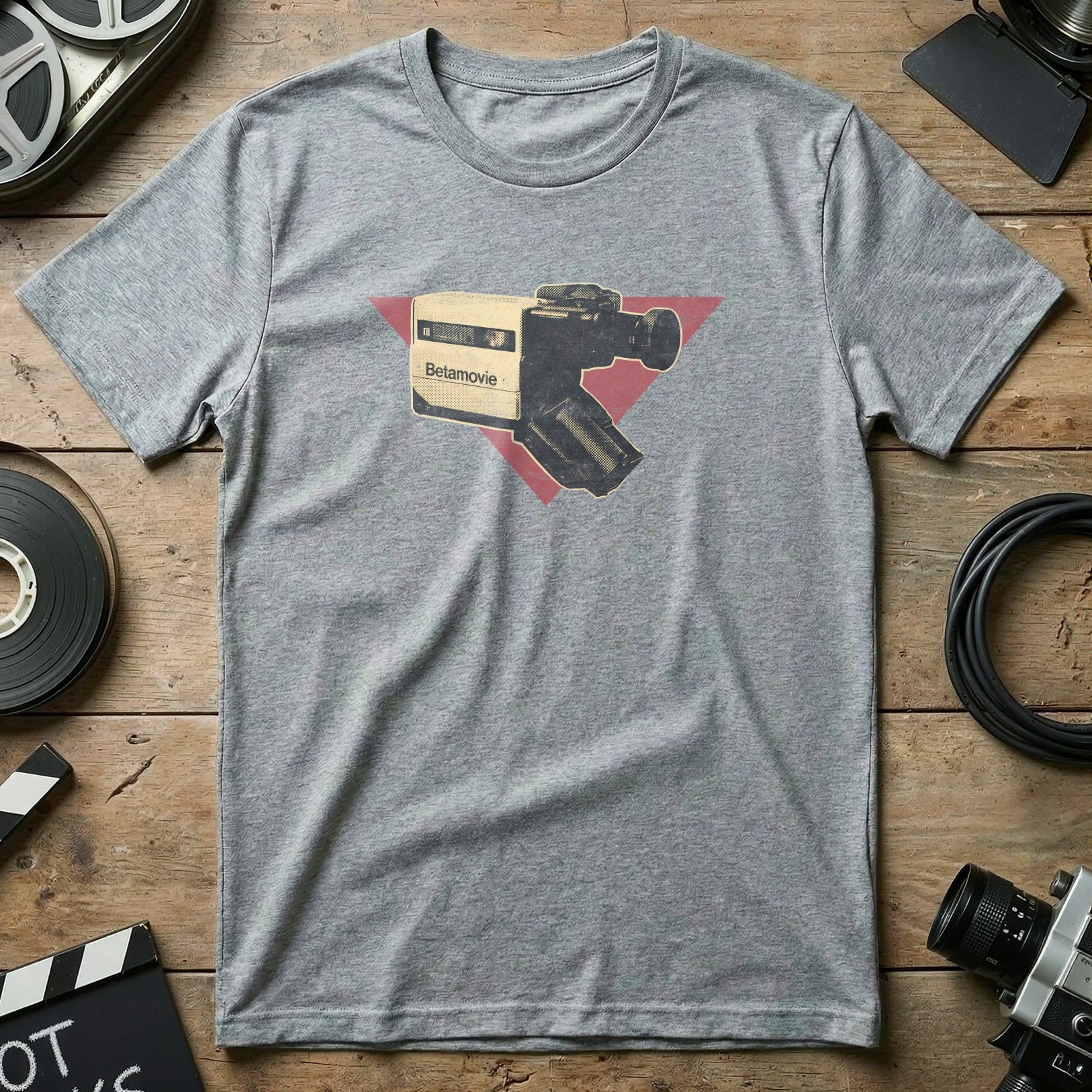 Grey t-shirt with vintage Belamovie video camera graphic and red triangle.