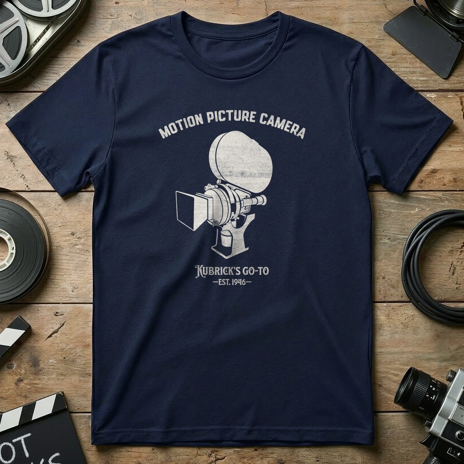 Navy t-shirt with "Motion Picture Camera Kubrick's Go-To" text and vintage camera graphic.