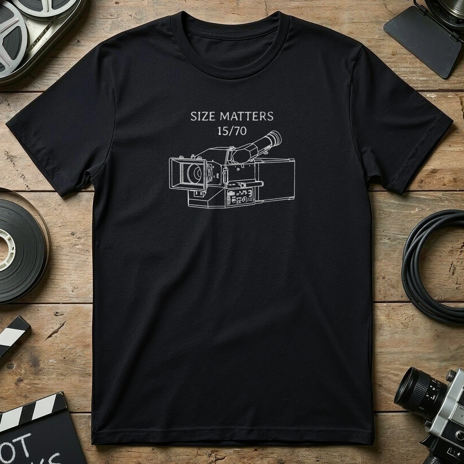 Black t-shirt with white line drawing of a vintage video camera and text "Size Matters 15/70".