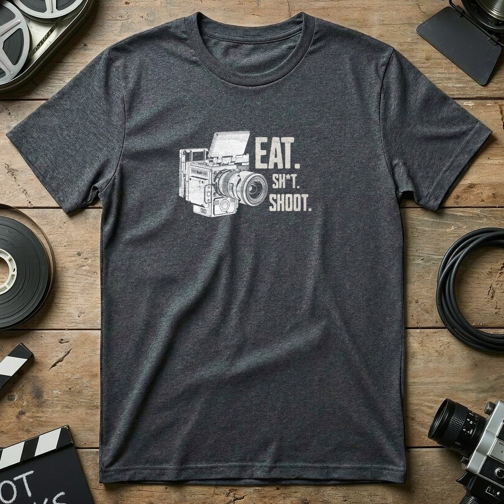 Dark grey t-shirt with "EAT. SH*T. SHOOT." and a vintage camera graphic.