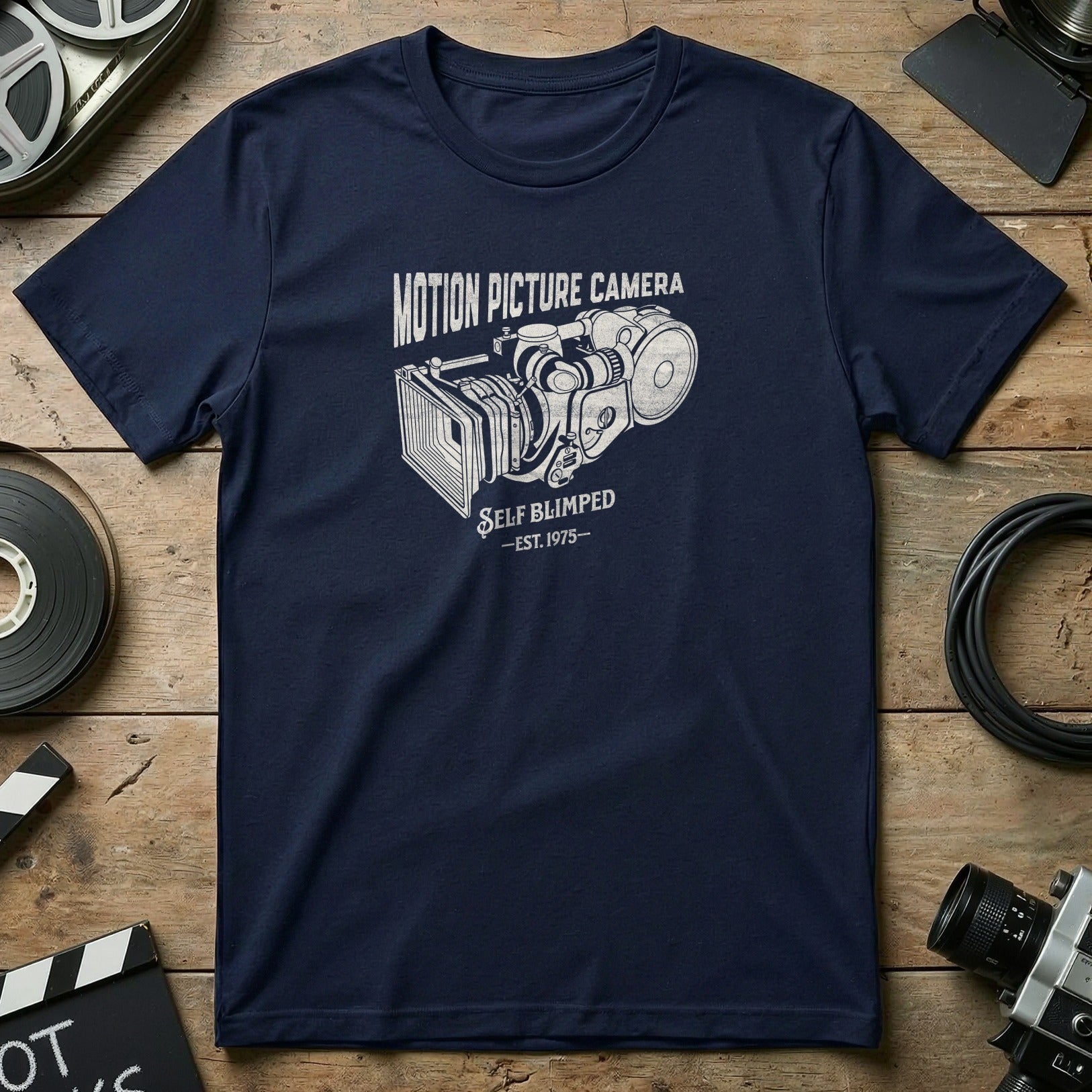 Navy t-shirt with vintage motion picture camera graphic and "Self Blimped - Est. 1975" text.