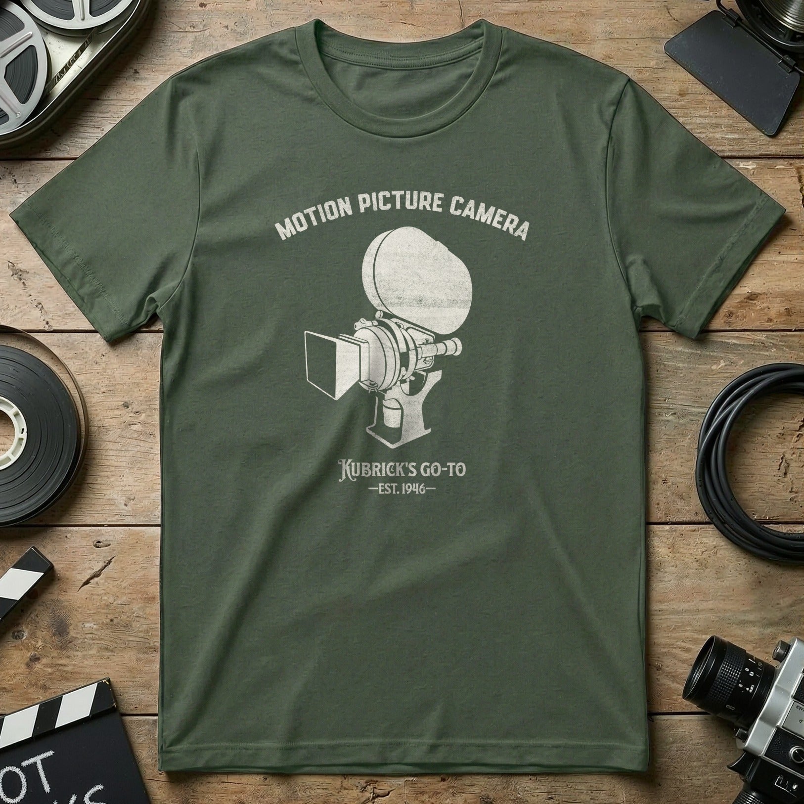 Olive t-shirt with vintage motion picture camera graphic and text.
