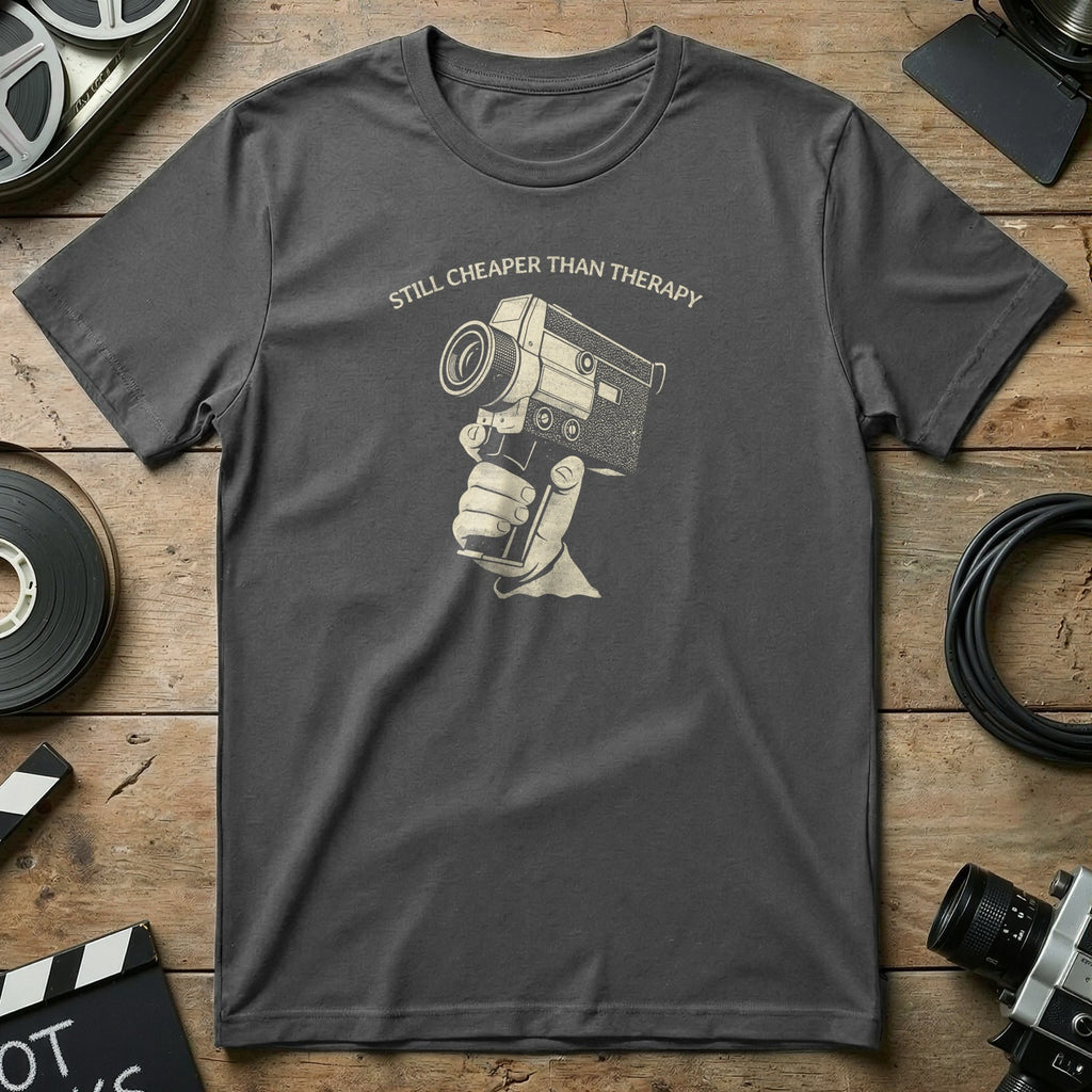 Gray t-shirt with vintage camera graphic and text "Still Cheaper Than Therapy".