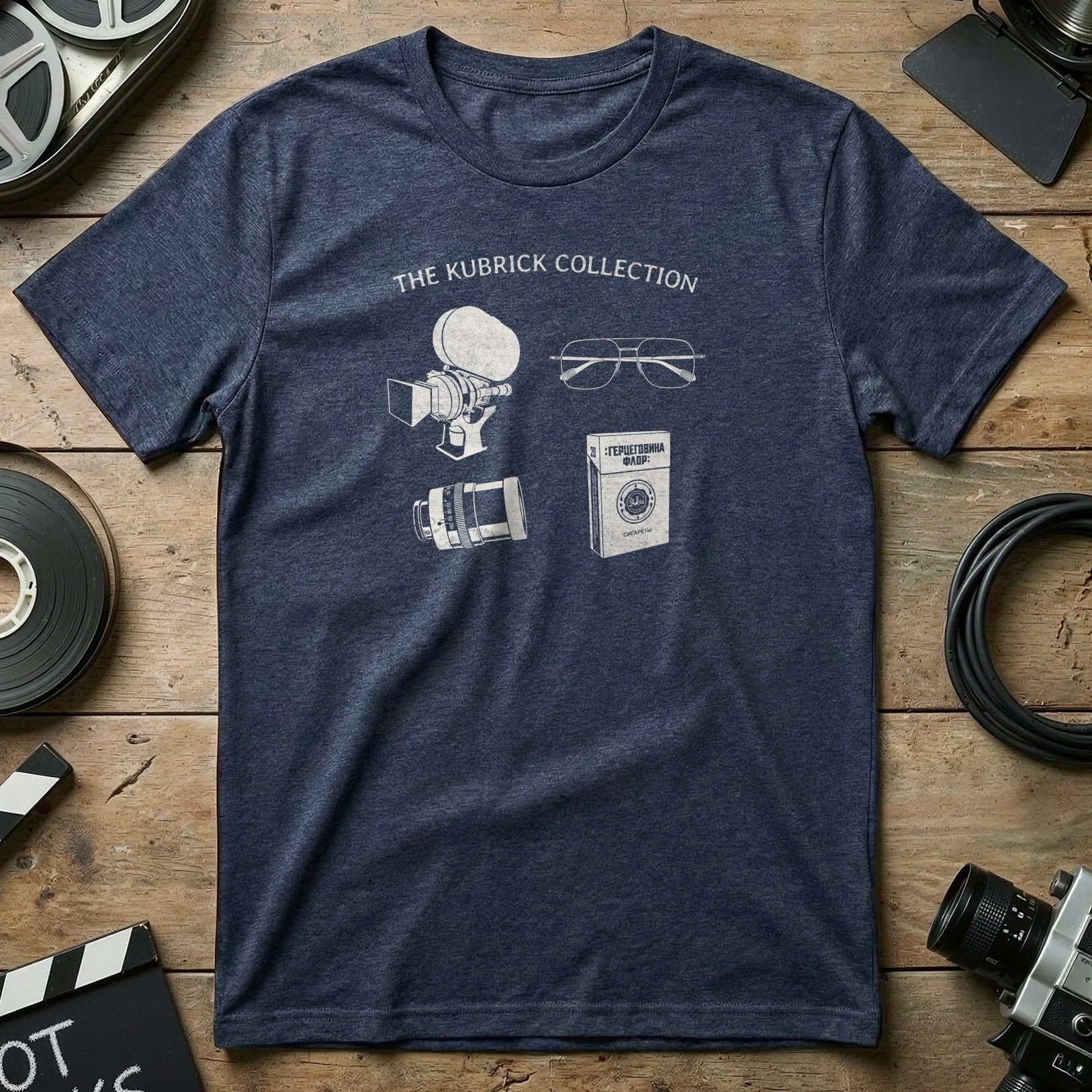 T-shirt with "The Kubrick Collection" and icons of camera, film reel, and glasses.