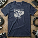 Dark blue t-shirt with "Motion Picture Camera Self Blimped Est. 1975" graphic.