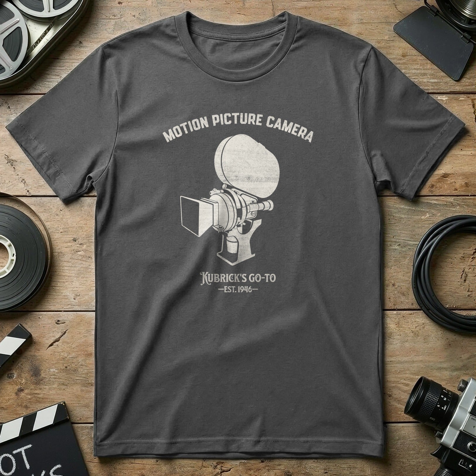 Dark grey t-shirt with "Motion Picture Camera Kubrick's Go-To EST. 1946" text.